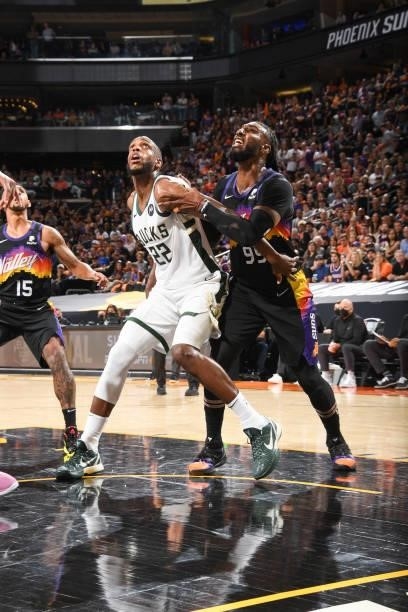 Khris Middleton of the Milwaukee Bucks and Jae Crowder of the Phoenix Suns fight for position during Game One of the 2021 NBA Finals on July 6, 2021...