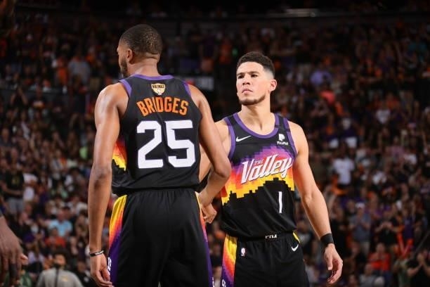 Devin Booker of the Phoenix Suns high fives Mikal Bridges of the Phoenix Suns during Game One of the 2021 NBA Finals on July 6, 2021 at Talking Stick...