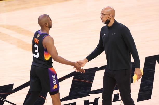 Head Coach Monty Williams of the Phoenix Suns hi-fives Chris Paul during Game One of the 2021 NBA Finals on July 6, 2021 at Phoenix Suns Arena in...