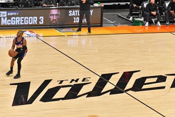 Chris Paul of the Phoenix Suns shoots the ball from half court against the Milwaukee Bucks during Game One of the 2021 NBA Finals on July 6, 2021 at...
