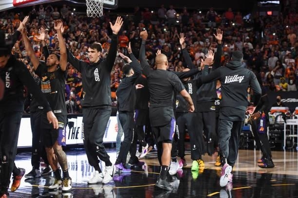 The Phoenix Suns high five each other before the game against the Milwaukee Bucks during Game One of the 2021 NBA Finals on July 6, 2021 at Phoenix...