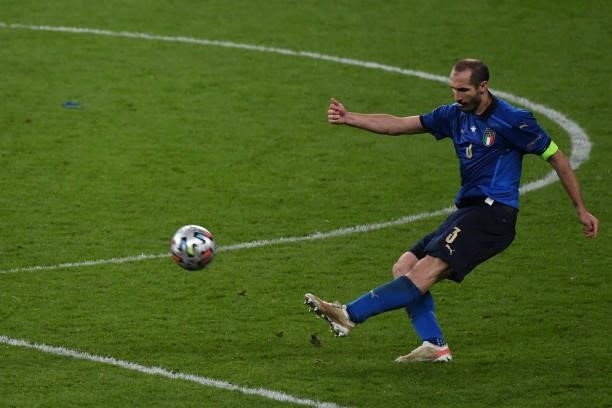 Giorgio Chiellini of Italy passes the ball during the UEFA Euro 2020 Championship Semi-final match between Italy and Spain at Wembley Stadium on July...