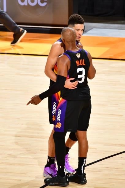 Chris Paul and Devin Booker of the Phoenix Suns embrace against the Milwaukee Bucks during Game One of the 2021 NBA Finals on July 6, 2021 at Phoenix...