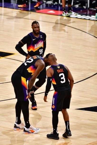Deandre Ayton and Chris Paul of the Phoenix Suns embrace during Game One of the 2021 NBA Finals on July 6, 2021 at Phoenix Suns Arena in Phoenix,...