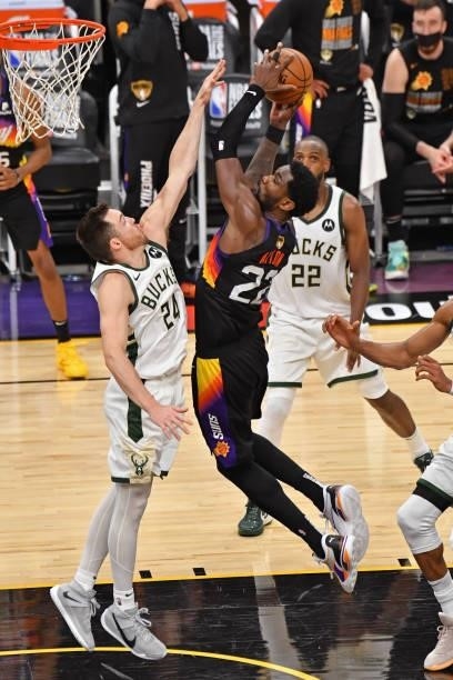 Deandre Ayton of the Phoenix Suns drives to the basket and shoots the ball against the Milwaukee Bucks during Game One of the 2021 NBA Finals on July...