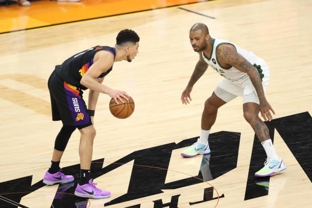 Tucker of the Milwaukee Bucks plays defense on Devin Booker of the Phoenix Suns during Game One of the 2021 NBA Finals on July 6, 2021 at Phoenix...
