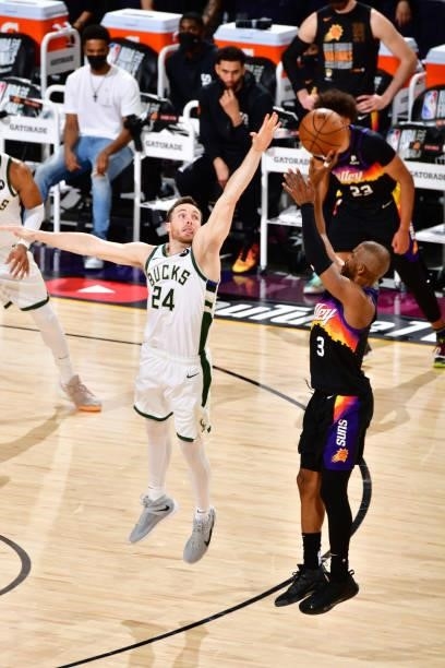 Chris Paul of the Phoenix Suns shoots a three point basket against the Milwaukee Bucks during Game One of the 2021 NBA Finals on July 6, 2021 at...