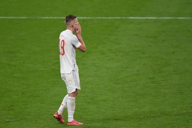 Dani Olmo of Spain reacts after missing penalty kick at penalty shoot out with Italy during the UEFA Euro 2020 Championship Semi-final match between...