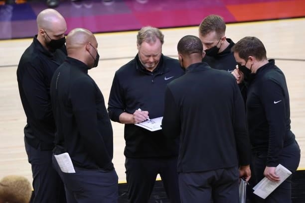 Head Coach Mike Budenholzer of the Milwaukee Bucks talks with the coaching staff during Game One of the 2021 NBA Finals on July 6, 2021 at Phoenix...