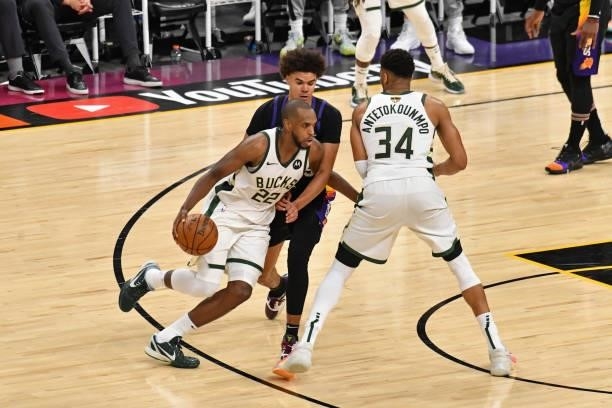 Khris Middleton of the Milwaukee Bucks dribbles the ball around a screen against the Phoenix Suns during Game One of the 2021 NBA Finals on July 6,...