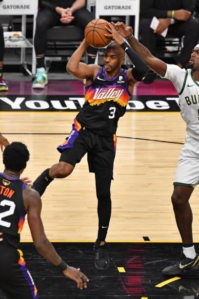 Chris Paul of the Phoenix Suns drives to the basket and passes the ball against the Milwaukee Bucks during Game One of the 2021 NBA Finals on July 6,...