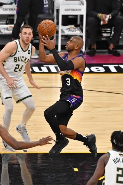 Chris Paul of the Phoenix Suns drives to the basket against the Milwaukee Bucks during Game One of the 2021 NBA Finals on July 6, 2021 at Phoenix...
