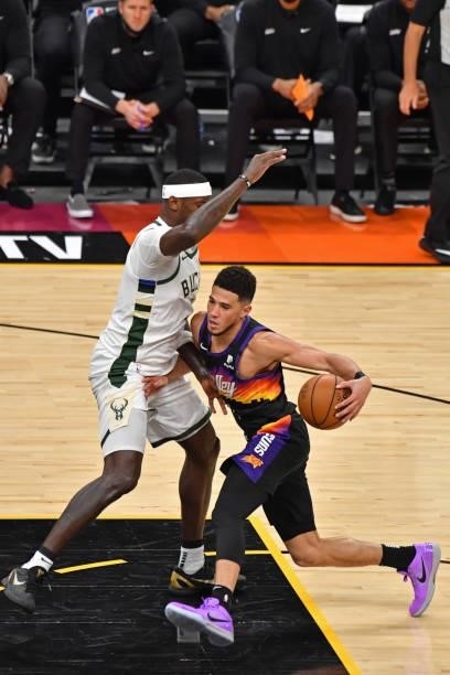 Devin Booker of the Phoenix Suns drives to the basket against the Milwaukee Bucks during Game One of the 2021 NBA Finals on July 6, 2021 at Phoenix...