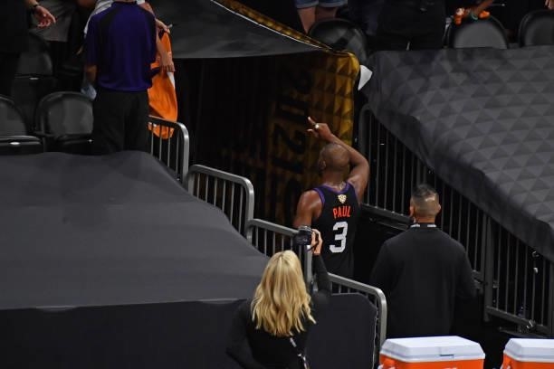 Chris Paul of the Phoenix Suns walks off the court and points to the crowd after Game One of the 2021 NBA Finals against the Milwaukee Bucks on July...