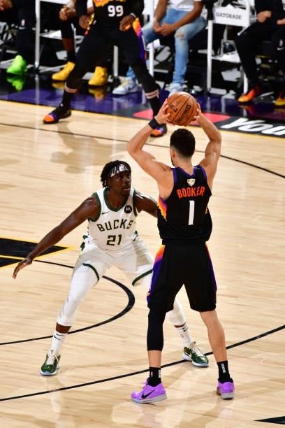 Jrue Holiday of the Milwaukee Bucks plays defense on Devin Booker of the Phoenix Suns during Game One of the 2021 NBA Finals on July 6, 2021 at...