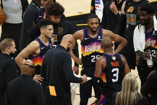 Head Coach Monty Williams of the Phoenix Suns talks with Devin Booker, Mikal Bridges and Chris Paul of the Phoenix Suns during Game One of the 2021...