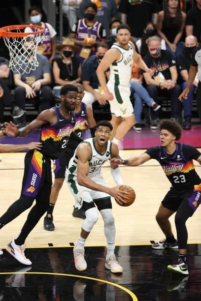 Cameron Johnson of the Phoenix Suns plays defense on Giannis Antetokounmpo of the Milwaukee Bucks during Game One of the 2021 NBA Finals on July 6,...