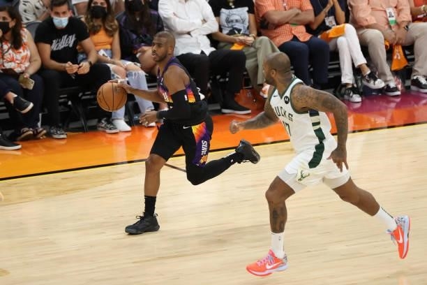 Chris Paul of the Phoenix Suns dribbles the ball during Game One of the 2021 NBA Finals on July 6, 2021 at Phoenix Suns Arena in Phoenix, Arizona....