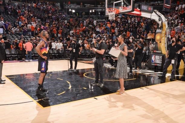Chris Paul of the Phoenix Suns talks to ESPN Sideline Reporter, Malika Andrews after the game against the Milwaukee Bucks during Game One of the 2021...