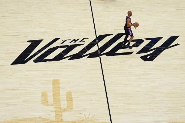 An overhead view of Chris Paul of the Phoenix Suns dribbling the ball at center court during Game One of the 2021 NBA Finals against the Milwaukee...