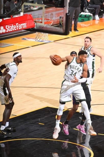 Giannis Antetokounmpo of the Milwaukee Bucks rebounds the ball during the game against the Phoenix Suns during Game One of the 2021 NBA Finals on...