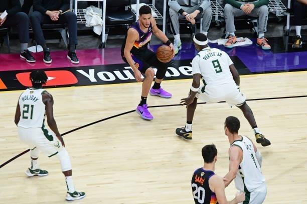 Devin Booker of the Phoenix Suns dribbles the ball against the Milwaukee Bucks during Game One of the 2021 NBA Finals on July 6, 2021 at Phoenix Suns...