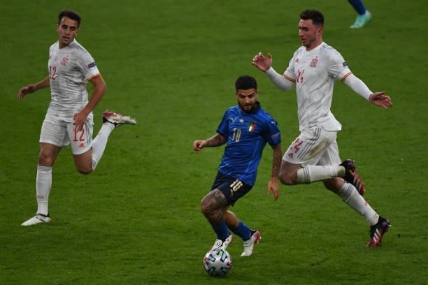 Lorenzo Insigne of Italy dribbles the ball under pressure from Aymeric Laporte of Spain during the UEFA Euro 2020 Championship Semi-final match...