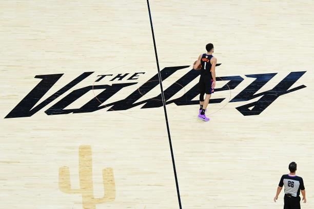 An overhead view of Devin Booker of the Phoenix Suns dribbling the ball at center court during Game One of the 2021 NBA Finals against the Milwaukee...