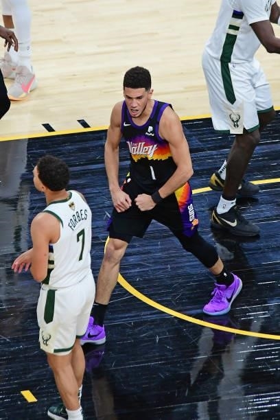 Devin Booker of the Phoenix Suns flexes and celebrates during Game One of the 2021 NBA Finals against the Milwaukee Bucks on July 6, 2021 at Phoenix...