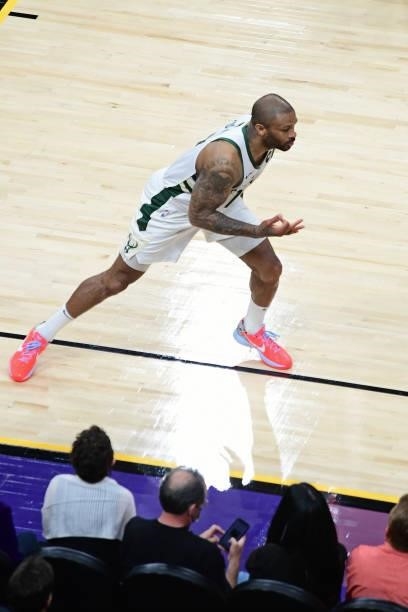 Tucker of the Milwaukee Bucks celebrates a three point basket and runs up court against the Phoenix Suns during Game One of the 2021 NBA Finals on...