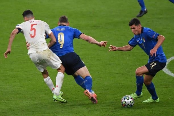 Matteo Pessina of Italy dribbles the ball while Andrea Belotti of Italy takes Sergio Busquets of Spain during the UEFA Euro 2020 Championship...