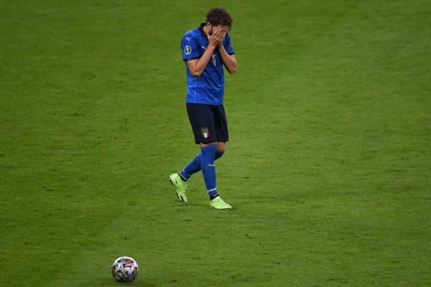 Manuel Locatelli of Italy reacts after missing a penalty kick during the UEFA Euro 2020 Championship Semi-final match between Italy and Spain at...