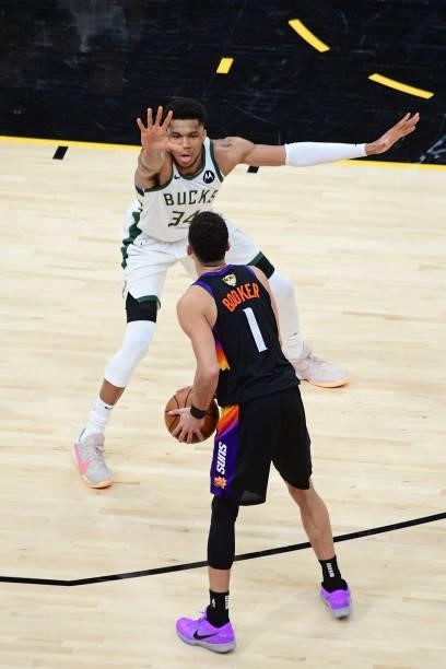 Giannis Antetokounmpo of the Milwaukee Bucks plays defense on Devin Booker of the Phoenix Suns during Game One of the 2021 NBA Finals on July 6, 2021...