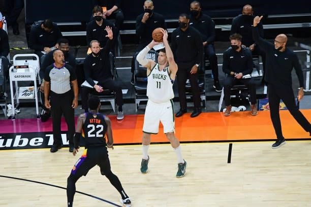 Brook Lopez of the Milwaukee Bucks shoots a three point basket against the Phoenix Suns during Game One of the 2021 NBA Finals on July 6, 2021 at...
