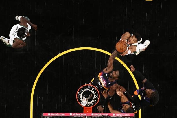 Deandre Ayton of the Phoenix Suns rebounds the ball against the Milwaukee Bucks during Game One of the 2021 NBA Finals on July 6, 2021 at Talking...