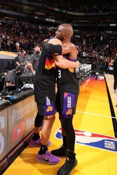 Chris Paul of the Phoenix Suns hugs Devin Booker of the Phoenix Suns after the game against the Milwaukee Bucks during Game One of the 2021 NBA...