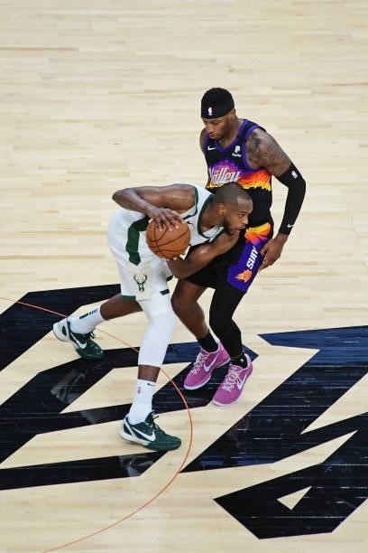 Khris Middleton of the Milwaukee Bucks dribbles the ball against the Phoenix Suns during Game One of the 2021 NBA Finals on July 6, 2021 at Phoenix...