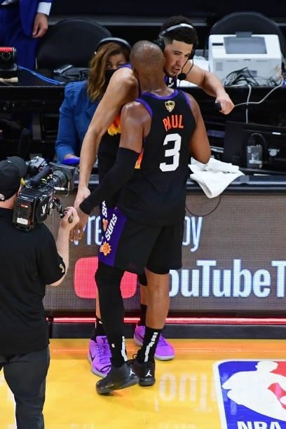 Devin Booker and Chris Paul of the Phoenix Suns hug on the court after Game One of the 2021 NBA Finals against the Milwaukee Bucks on July 6, 2021 at...