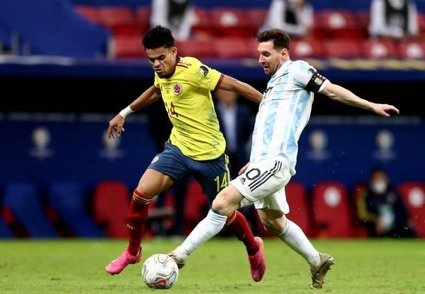 Lionel Messi of Argentina competes for the ball with Luis Diaz of Colombia during the Conmebol Copa America Brazil 2021 semi-final between Argentina...