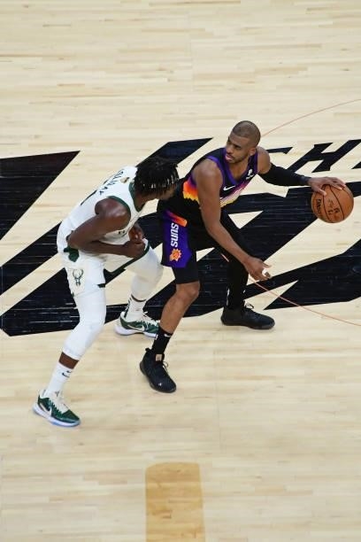 True Holiday of the Milwaukee Bucks plays defense on Chris Paul of the Phoenix Suns during Game One of the 2021 NBA Finals on July 6, 2021 at Phoenix...