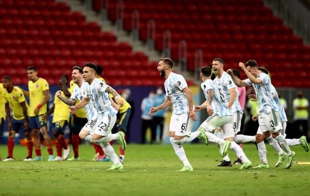 Lionel Messi ,Lautaro Martinez ,German Pezzella and Guido Rodriguez of Argentina celebrate with teammates winning a Penalty Shootout ,after the...
