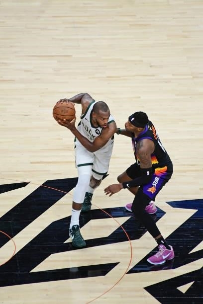 Khris Middleton of the Milwaukee Bucks dribbles the ball against the Phoenix Suns during Game One of the 2021 NBA Finals on July 6, 2021 at Phoenix...