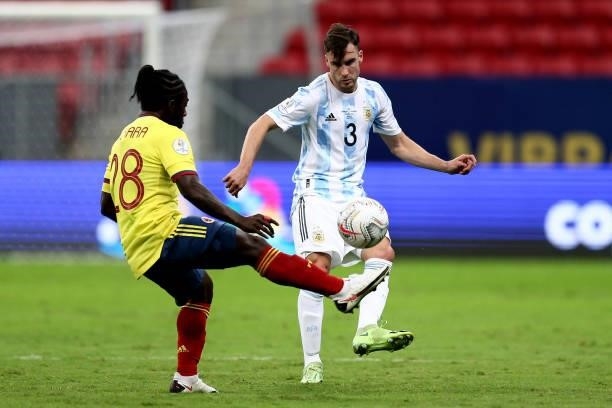 Nicolas Tagliafico of Argentina competes for the ball with Yimmi Chara of Colombia ,during the Semifinal match between Argentina and Colombia as part...
