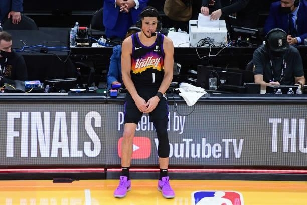 Devin Booker of the Phoenix Suns talks to the media on the court after Game One of the 2021 NBA Finals against the Milwaukee Bucks on July 6, 2021 at...