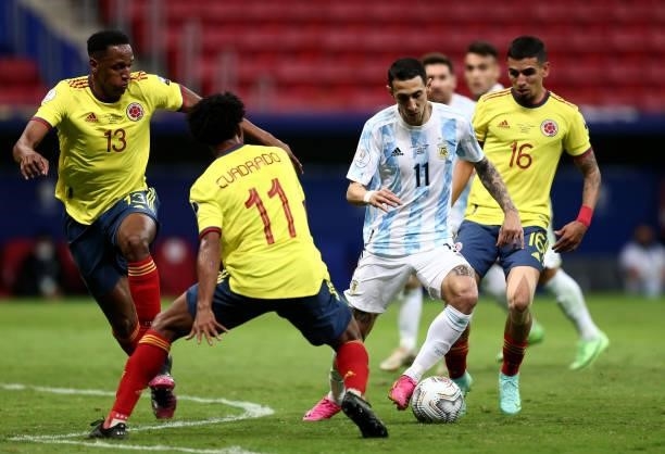 Angel Di Maria of Argentina competes for the ball with Yerry Mina ,Juan Cuadrado and Rafael Santos Borre of Colombia during the Conmebol Copa America...