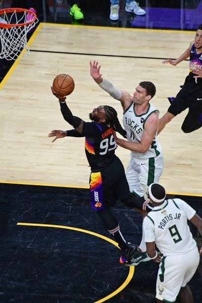 Jae Crowder of the Phoenix Suns drives to the basket against the Milwaukee Bucks during Game One of the 2021 NBA Finals on July 6, 2021 at Phoenix...