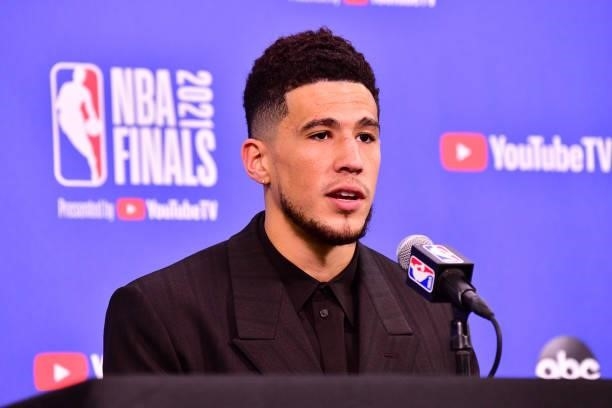 Devin Booker of the Phoenix Suns talks to the media after the game against the Milwaukee Bucks during Game One of the 2021 NBA Finals on July 6, 2021...