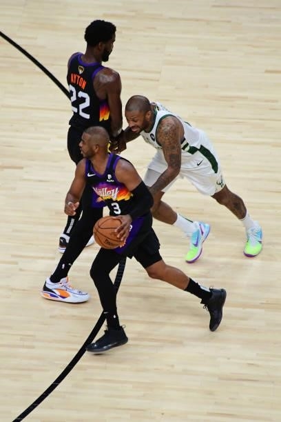 Chris Paul of the Phoenix Suns drives to the basket around a screen against the Milwaukee Bucks during Game One of the 2021 NBA Finals on July 6,...