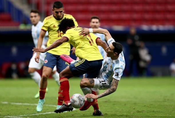 Angel Di Maria of Argentina competes for the ball with Juan Cuadrado and Rafael Santos Borre of Colombia during the Conmebol Copa America Brazil 2021...