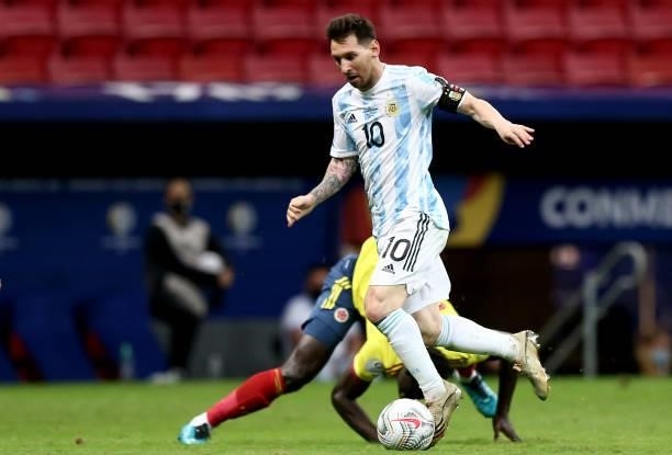 Lionel Messi of Argentina competes for the ball with Davinson Sanchez of Colombia ,during the Semifinal match between Argentina and Colombia as part...